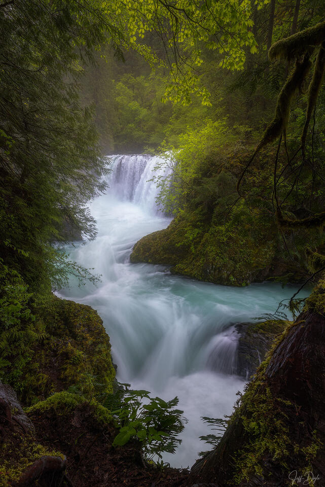 Spirit Falls Waterfall Framed by Lush Forest and Turquoise Cascade