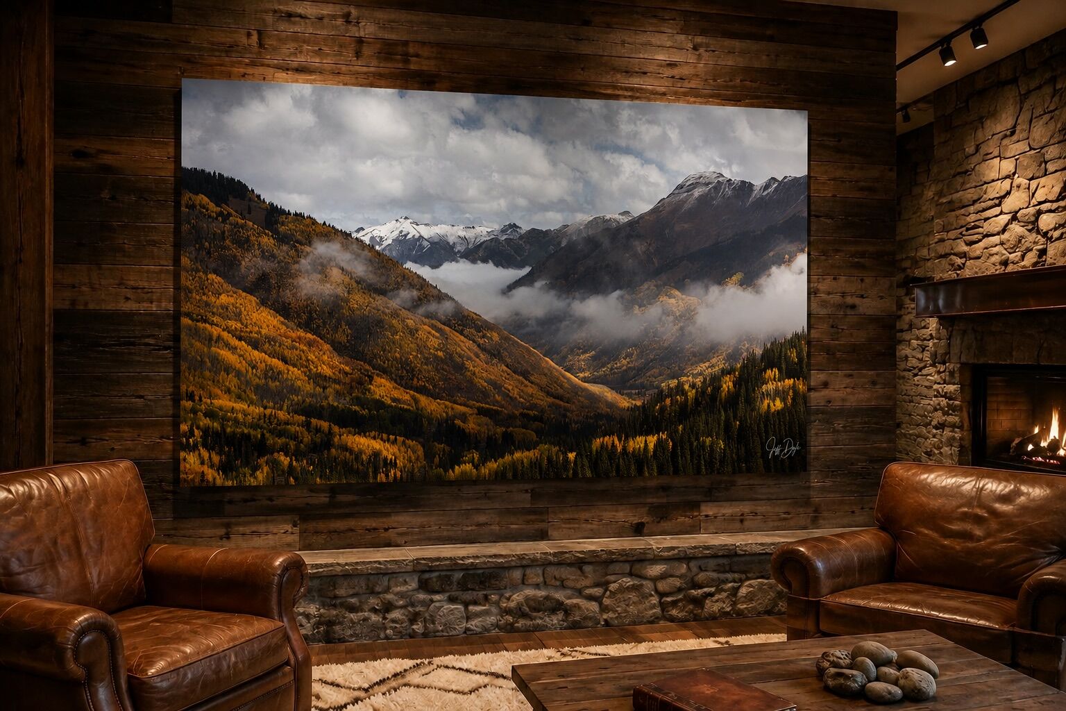 Veins of Gold autumn mountain landscape print displayed in a rustic lodge with reclaimed wood walls, leather chairs, and a stone fireplace.
