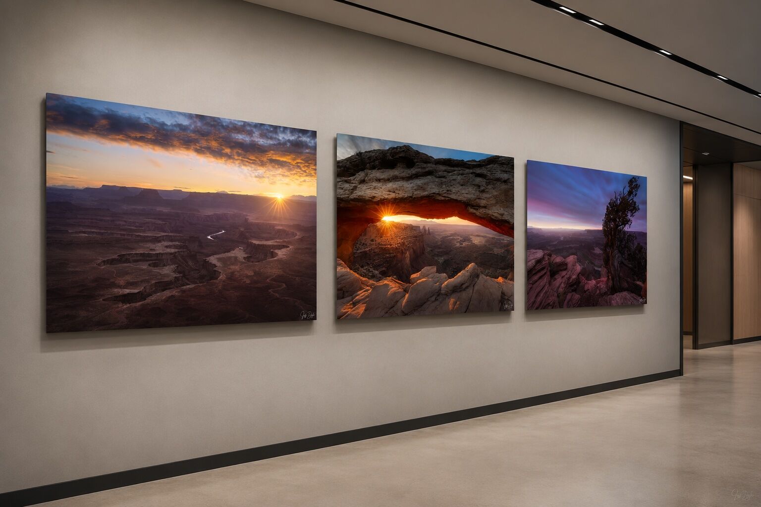 Three frameless ChromaLuxe metal prints featuring Utah desert landscapes displayed in an evenly spaced series along a modern corporate corridor.