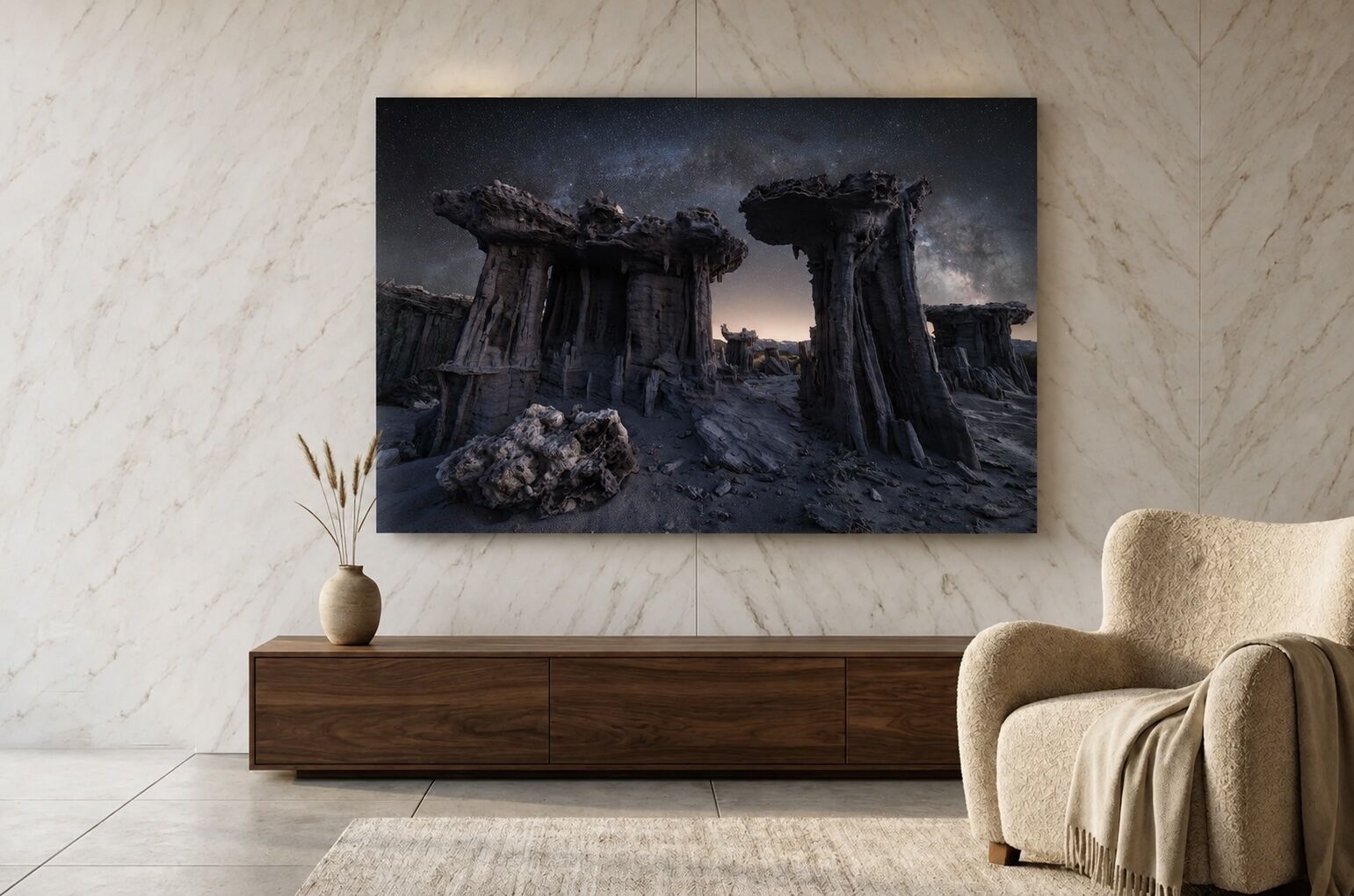 Large Cathedrals of Stone Milky Way landscape print displayed above a walnut console in a modern marble-walled living room.