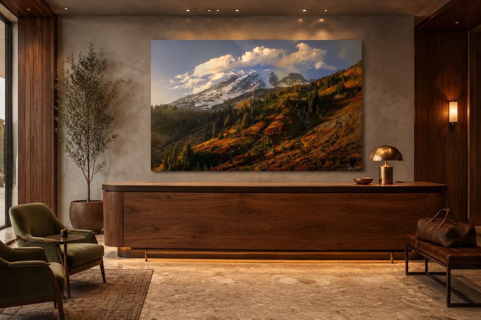 Image of Mount Rainier in the fall displayed as a large frameless acrylic print behind a walnut reception desk in a warm boutique hotel lobby.