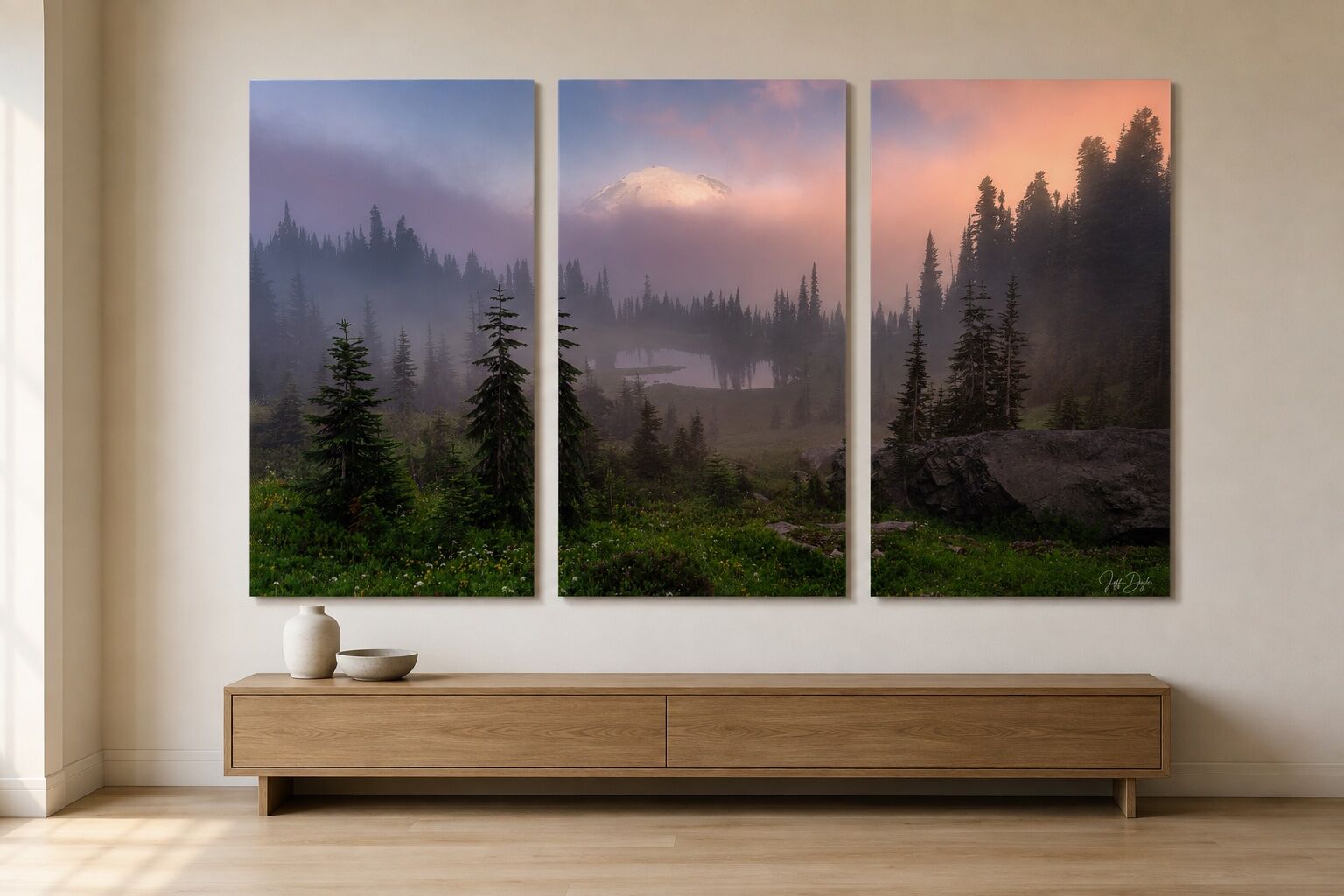 Mount Rainier photograph divided across three vertical acrylic panels above a low oak console in a contemporary interior.