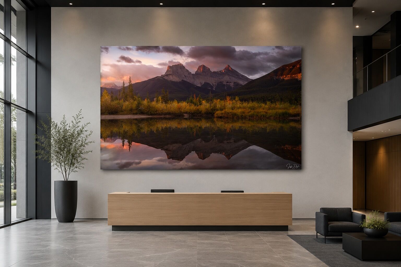 Photo of The Three Sisters in Banff displayed as a large frameless Lumachrome TruLife acrylic print in a modern corporate lobby.